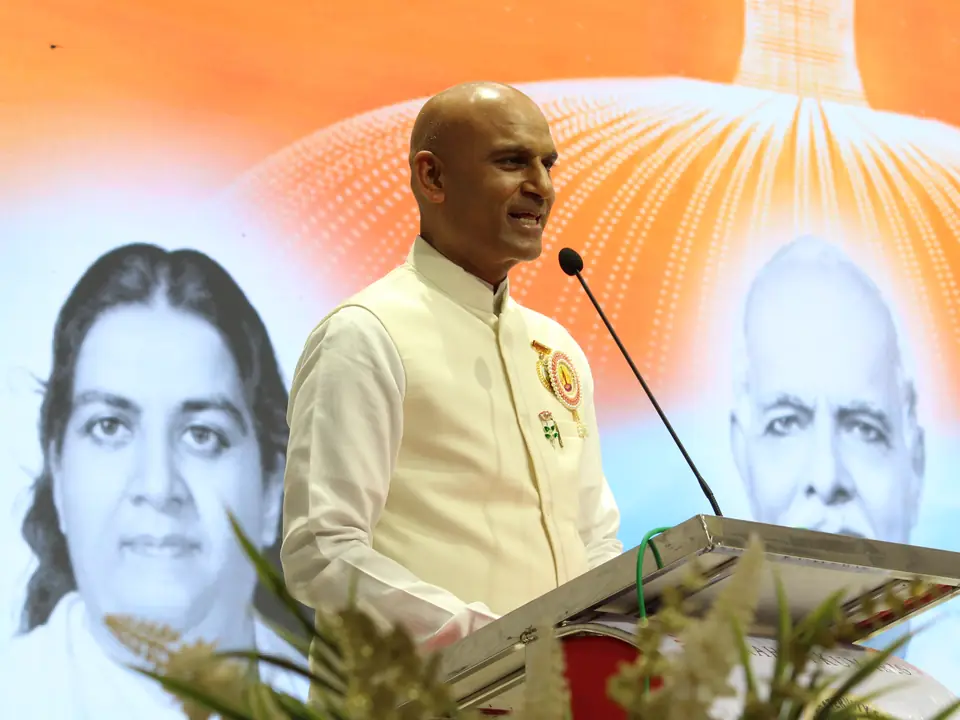 A speaker addressing the gathering at the reception