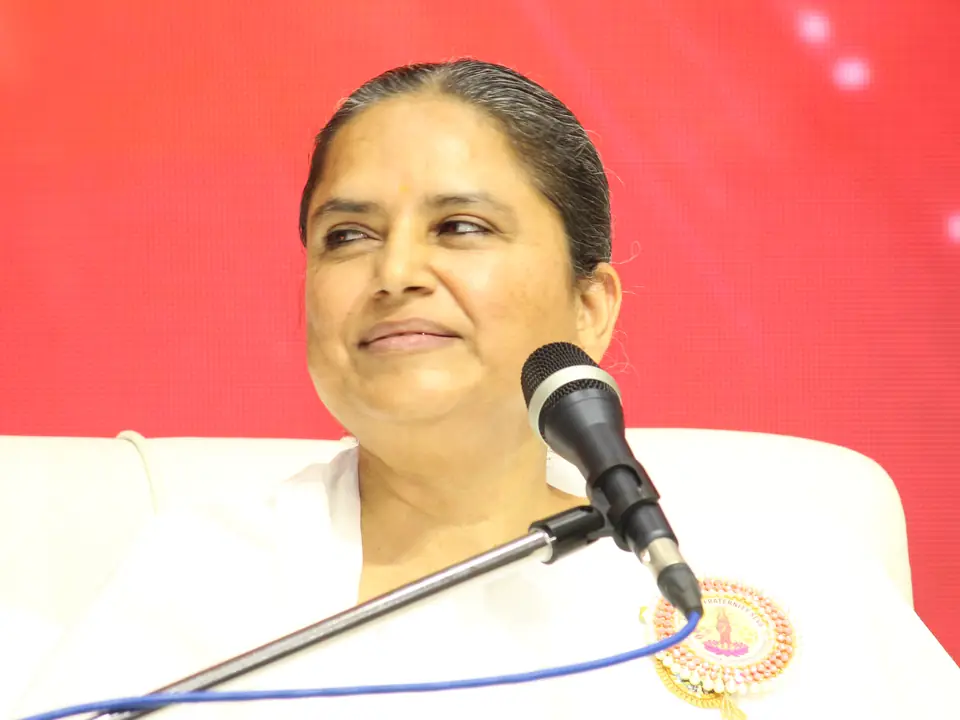 BK Ishita Didi speaking at a microphone