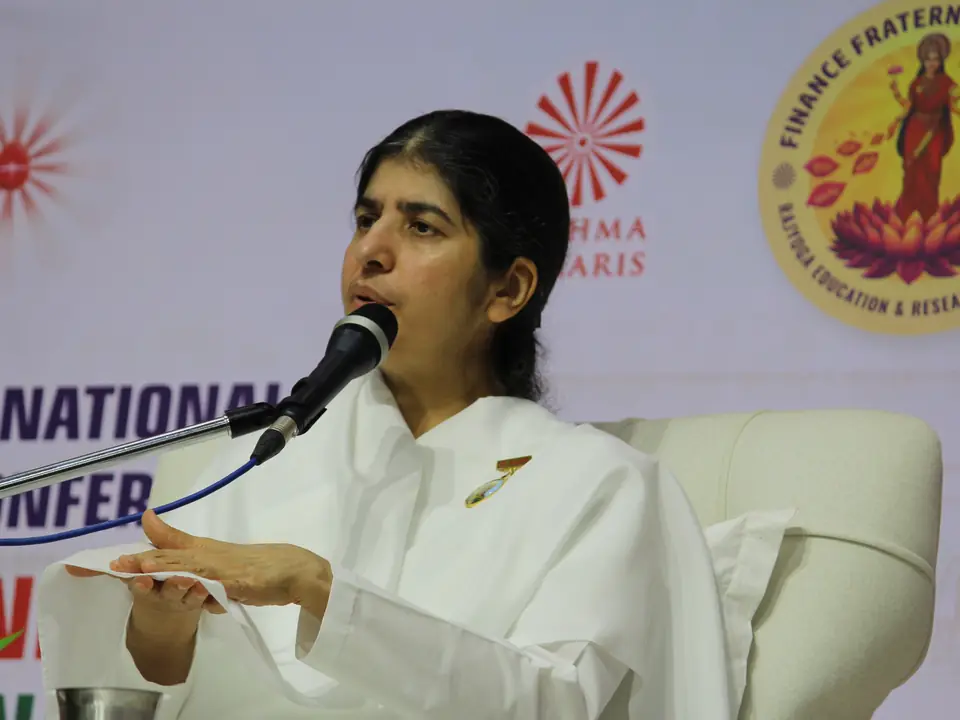 BK Shivani Didi speaking at a microphone on stage