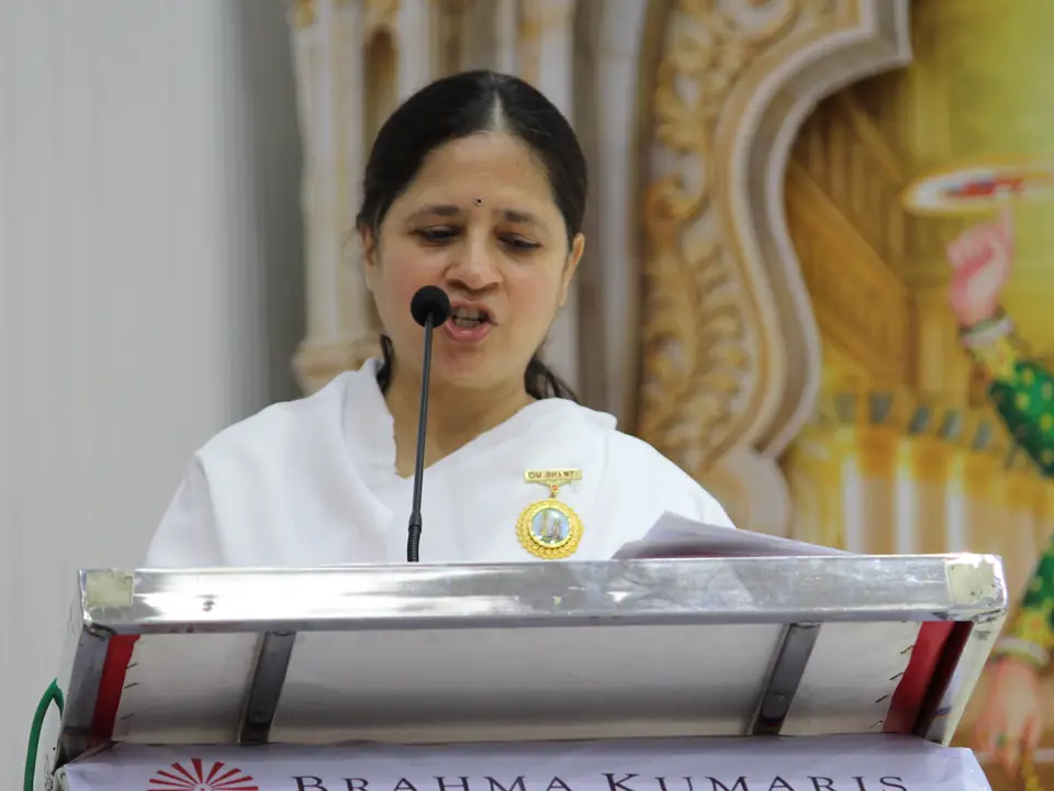 A Brahma Kumaris sister delivering the valedictory address at the podium